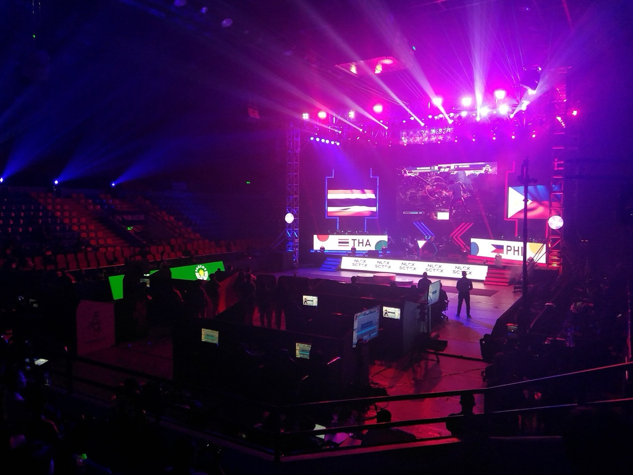 Thailand and Philippines players competing on a purple-lit esports stage at the 2019 SEA Games