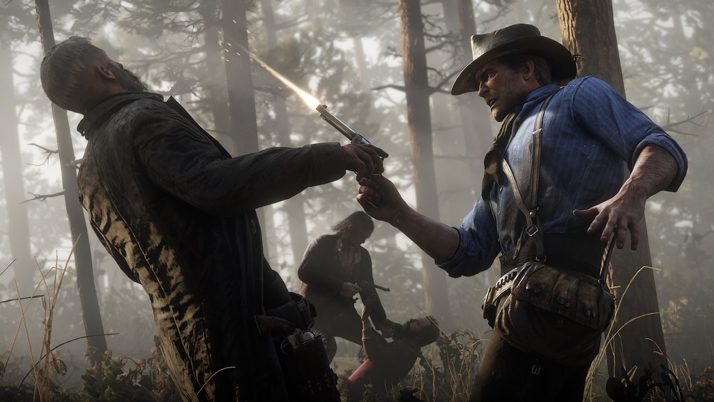 Arthur disarms an outlaw during a confrontation in the woods