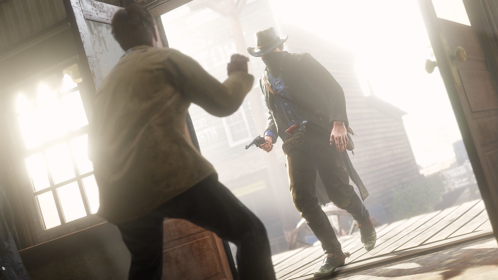 A masked Arthur confronts a witness inside a frontier building